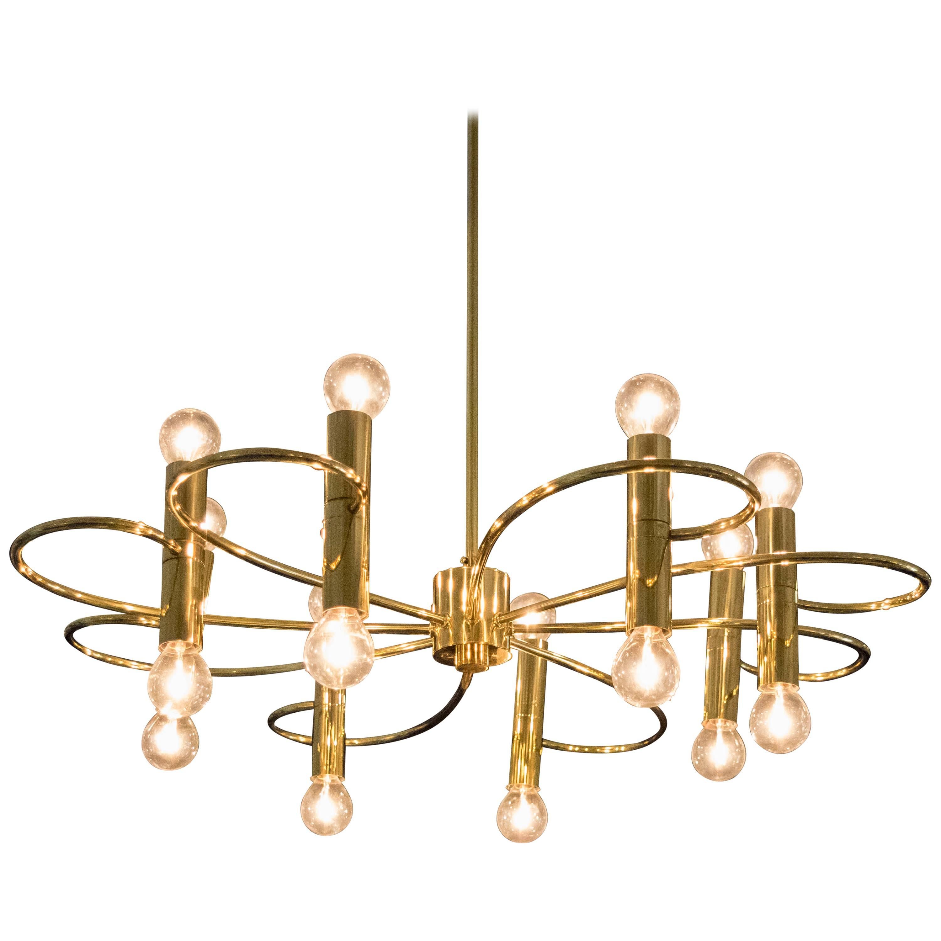 Sculptural Sciolari sixteen-light chandelier with graceful brass curved detailing newly restored and rewired.
