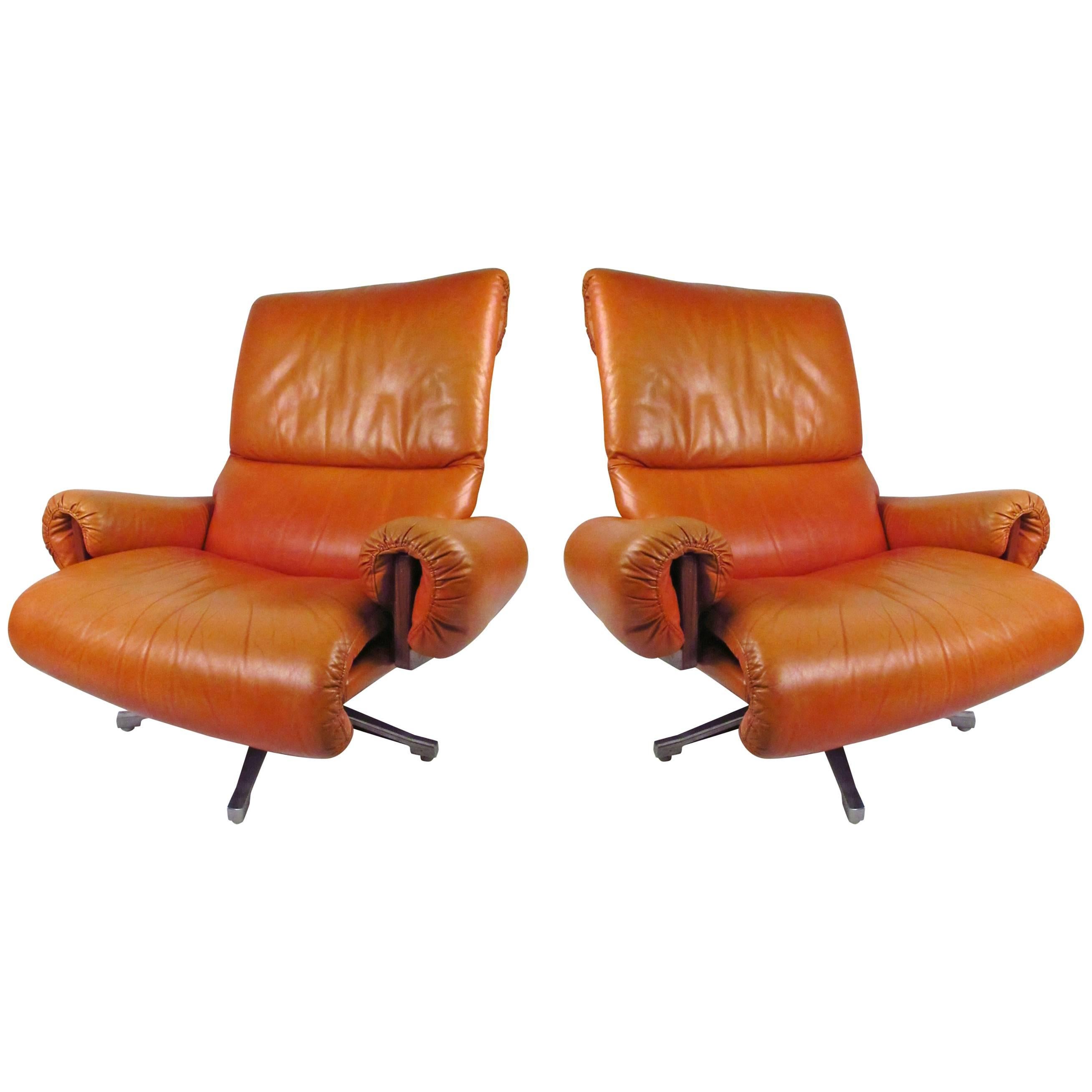 Pair of Vintage Rosewood and Leather Swivel Lounge Chairs