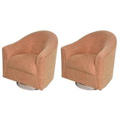 Pair mid century modern Milo Baughman style swivel barrel back lounge chairs