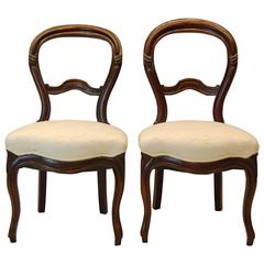 Two Victorian Carved Walnut Side Chairs, circa 1870