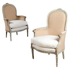 A Fine Pair of French Neoclassical Bergere Armchairs