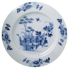 Delftware earthenware pottery charger in blue and white