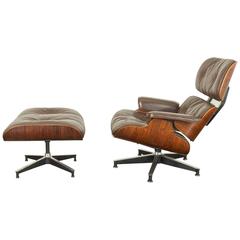 Eames 670 Rosewood Lounge Chair aus braunem Leder