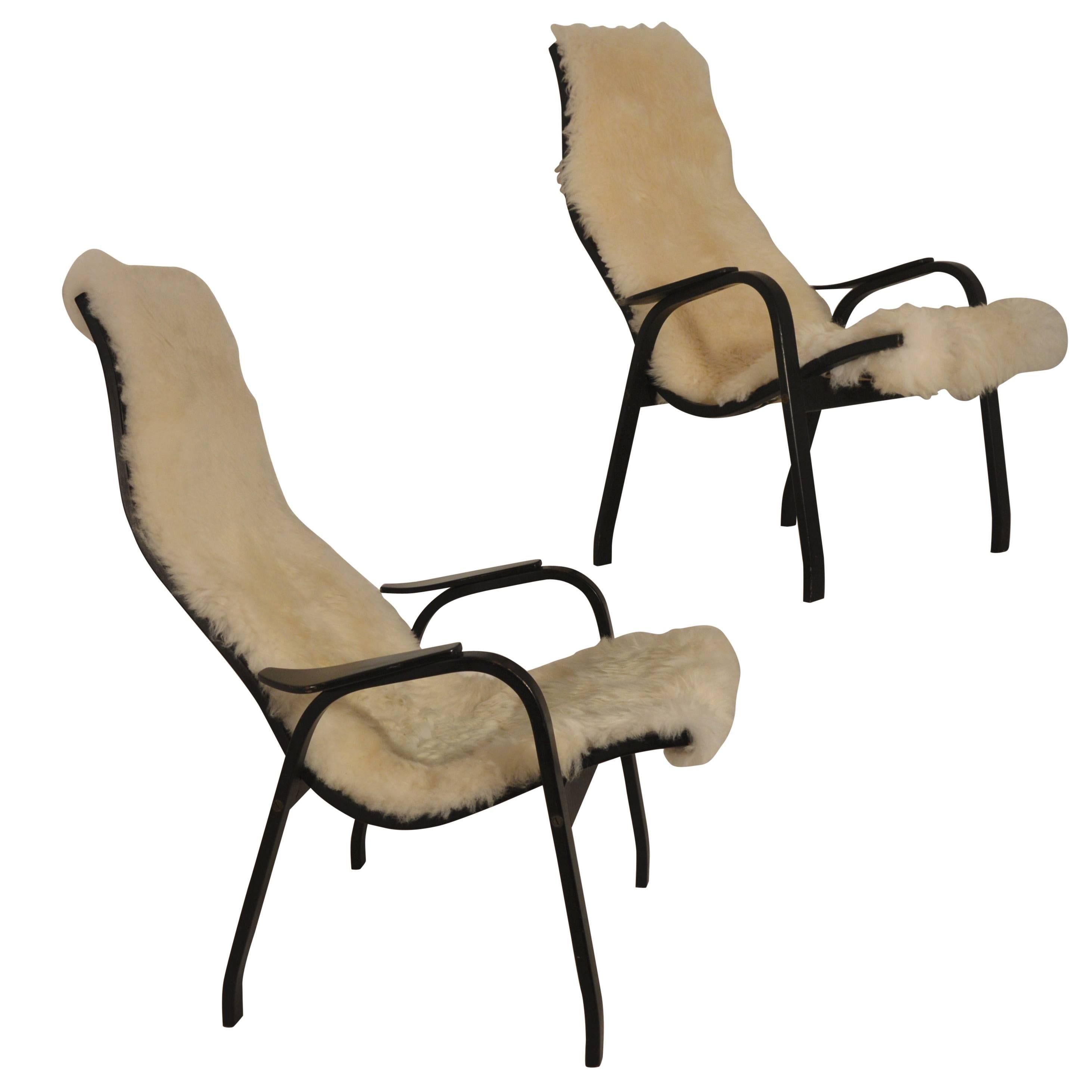 Pair of  high-back Kurva chairs by Yngve Ekstrom for Swedese.
