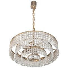 A 1960s German Four Tier Chandelier with Faceted Glass Beads and Brass Frame