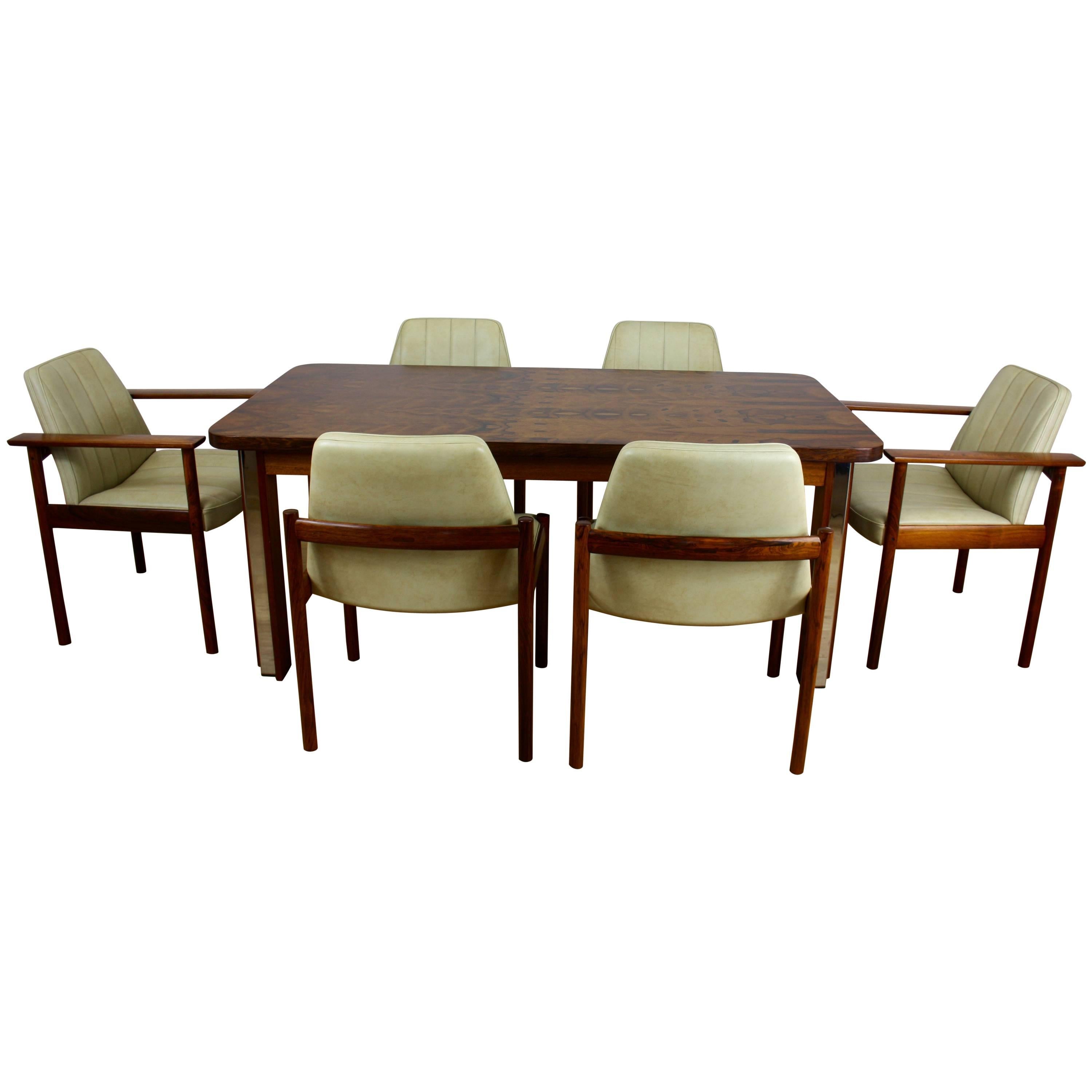 MID TWENTIETH CENTURY DESIGN ROSEWOOD DINING TABLE And CHAIRS