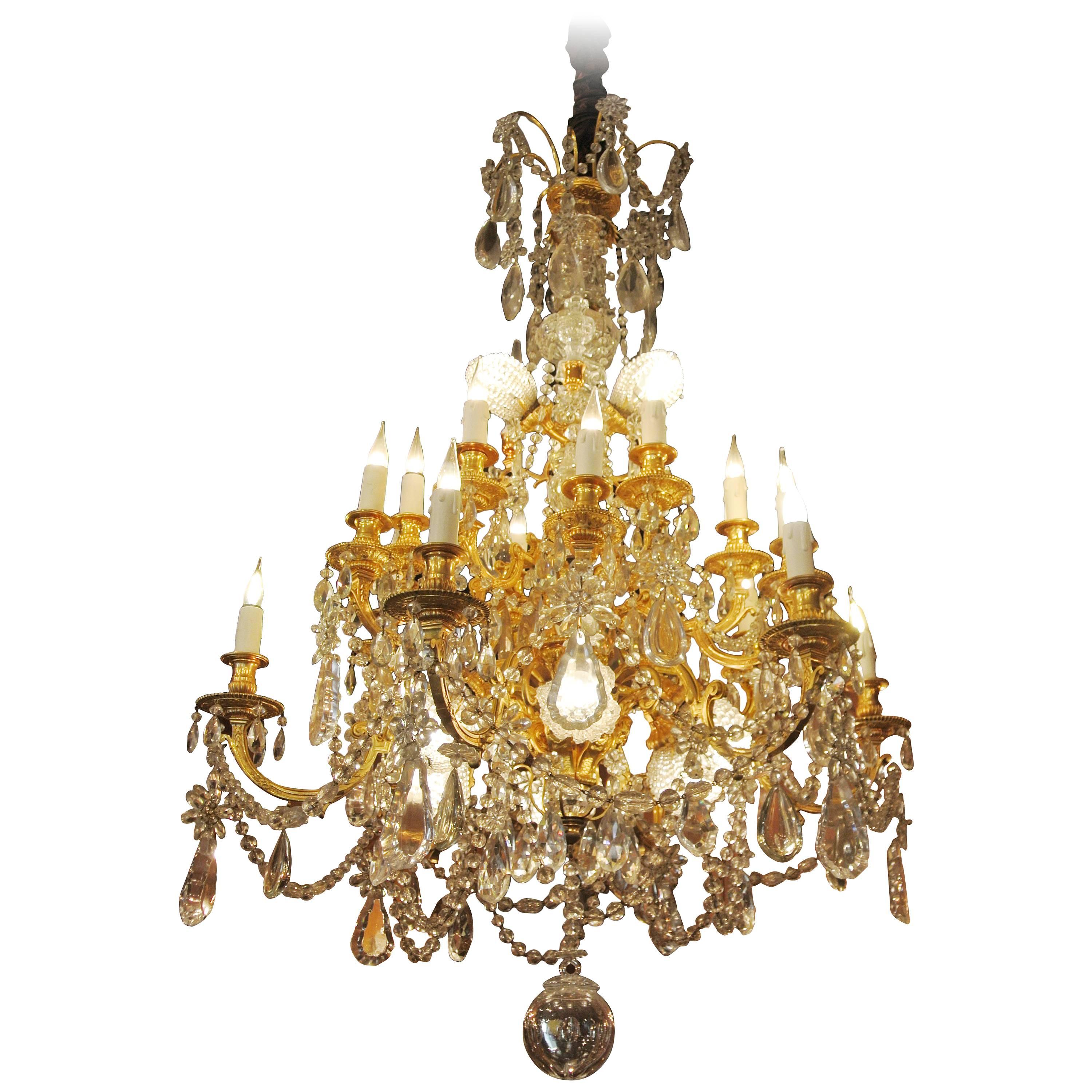 A Fine Important Baccarat Crystal Chandelier in Bronze Dore and Carved Crystal