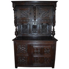 Early 19th Century English carved oakwood tudor cabinet