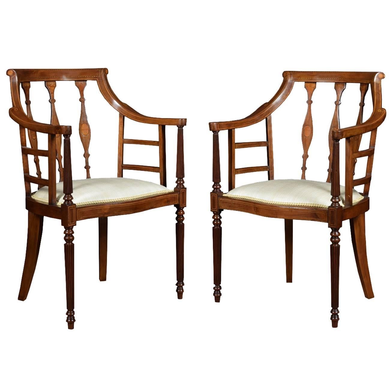 Pair of Edwardian Mahogany inlaid arm chairs 