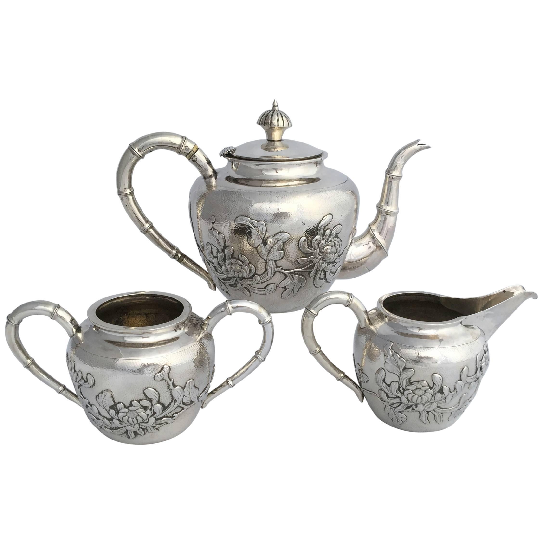 Chinese Export Silver Three-Piece Tea Set with Chrysanthemum Detail Dating For Sale