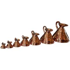 Set of Seven English Copper Measures