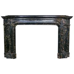 A large Antique French Fireplace Mantel in Portoro Marble 