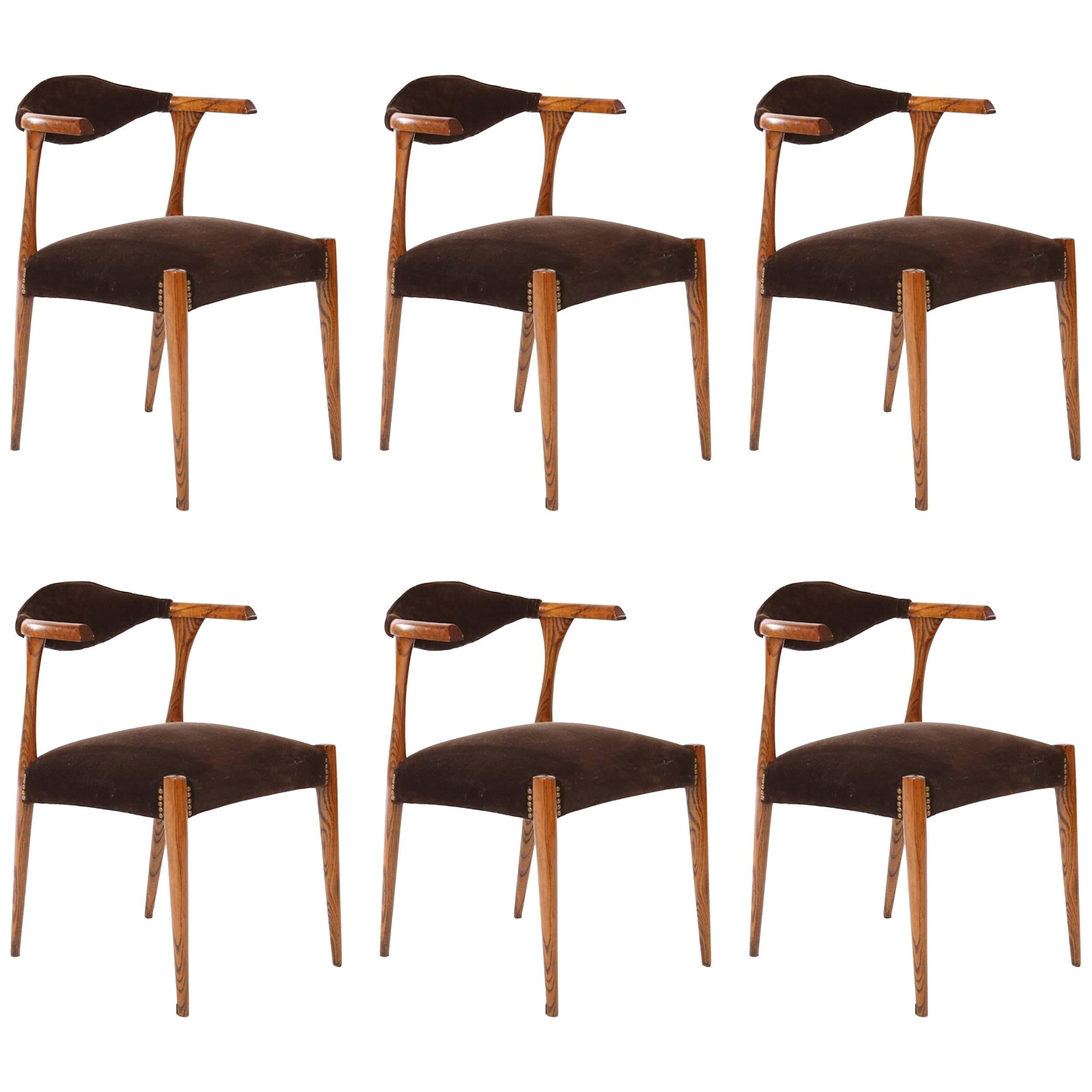 Cabinetmaker Chairs
Denmark, c. 1960

Set of six available- will split set. Oak frame, upholstered back over nailhead trimmed upholstered seats.  Recently reupholstered in chocolate brown cotton velvet.

Dimensions: 30