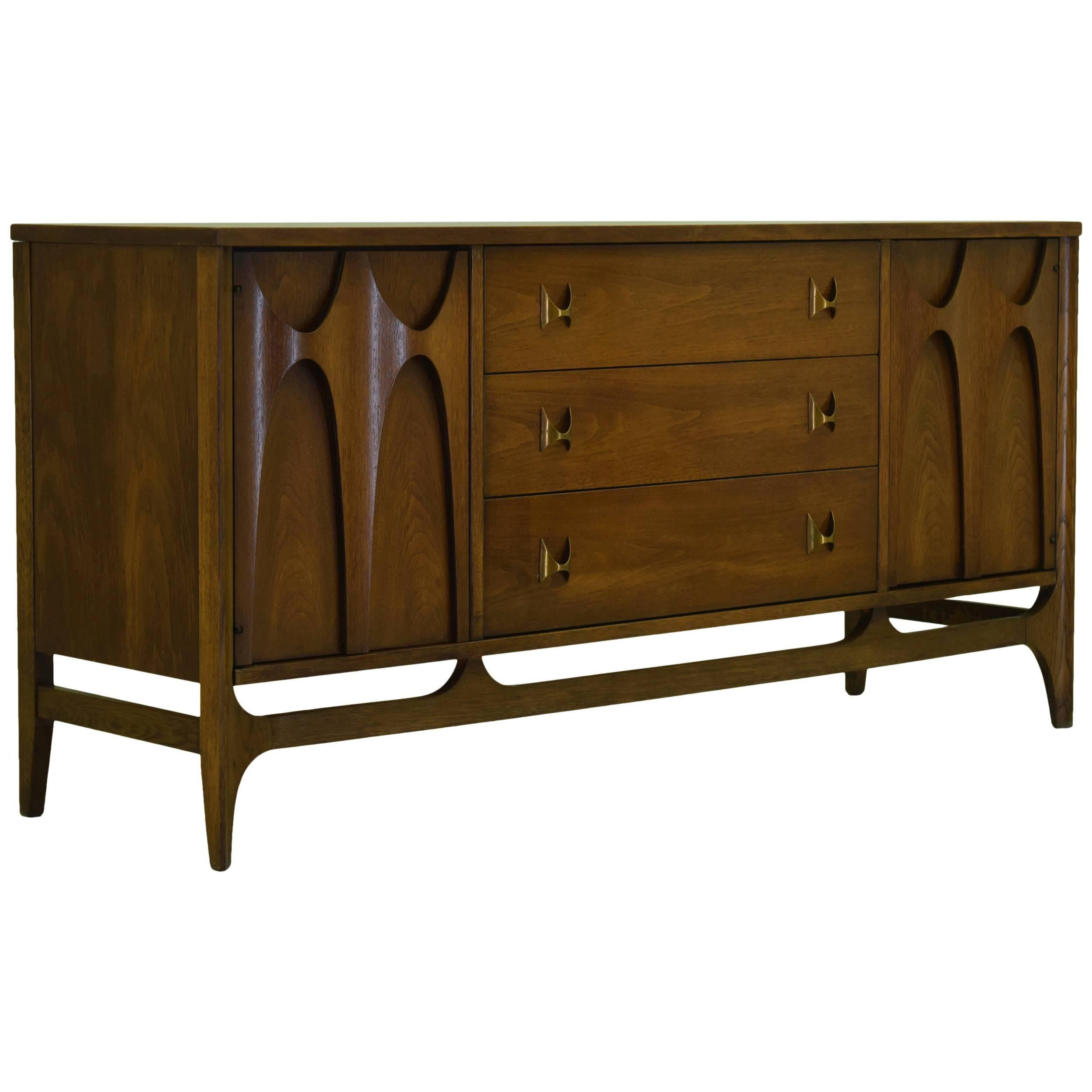 Price is for both buffet and the hutch.

The Broyhill Brasilia series inspired by Oscar Niemeyer is now widely recognized as the best mid century era design series produced by Broyhill. Coveted for iconic raised walnut designs that extend beyond