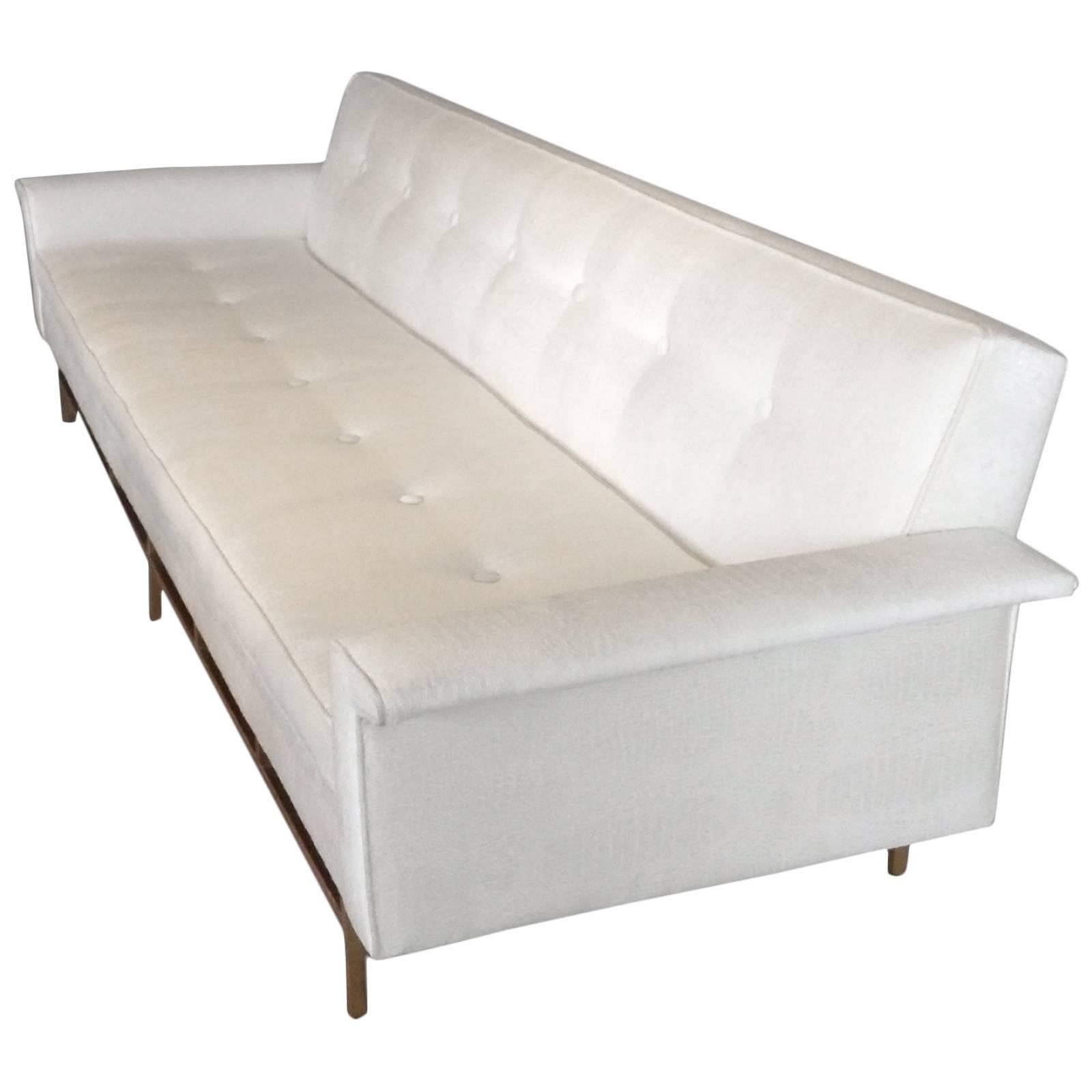 Ben Seibel for Stand Built  Dunbar style white sofa on architectural brass base For Sale