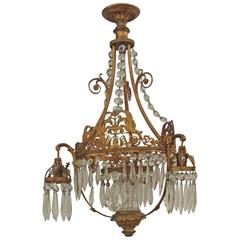 Antique An unusual gilt brass and cut glass chandelier