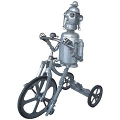 Used Robot Riding an Aluminum Tricycle