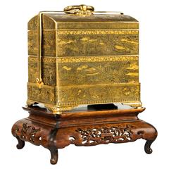 A superb and rare gold inlaid iron jubako (lunch box) by Komai of Kyoto