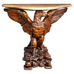 A late 19th century Swiss 'Black Forest' carved walnut console table