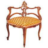 Fauteuil d'angle français de style Louis XV en noyer sculpté