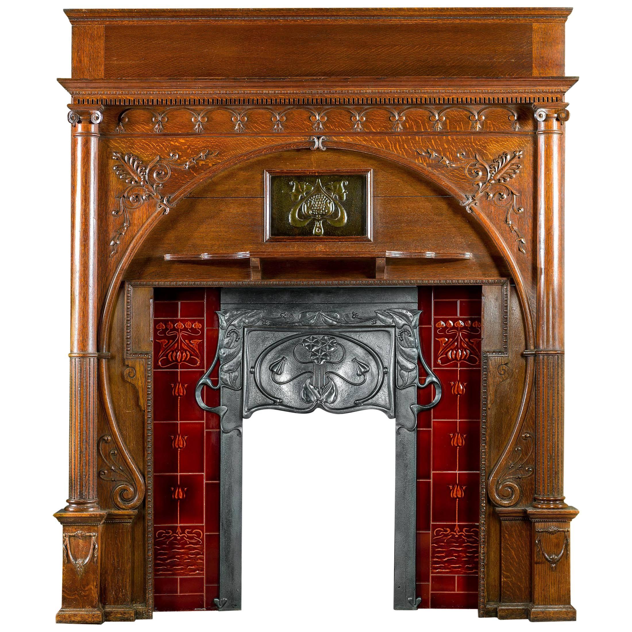 Carved Oak Art Nouveau Antique Fireplace Mantel and Integral Cast Iron Insert