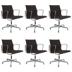 Set of Six Eames Aluminum Group Armchairs in Black Fabric with Five-Star Bases