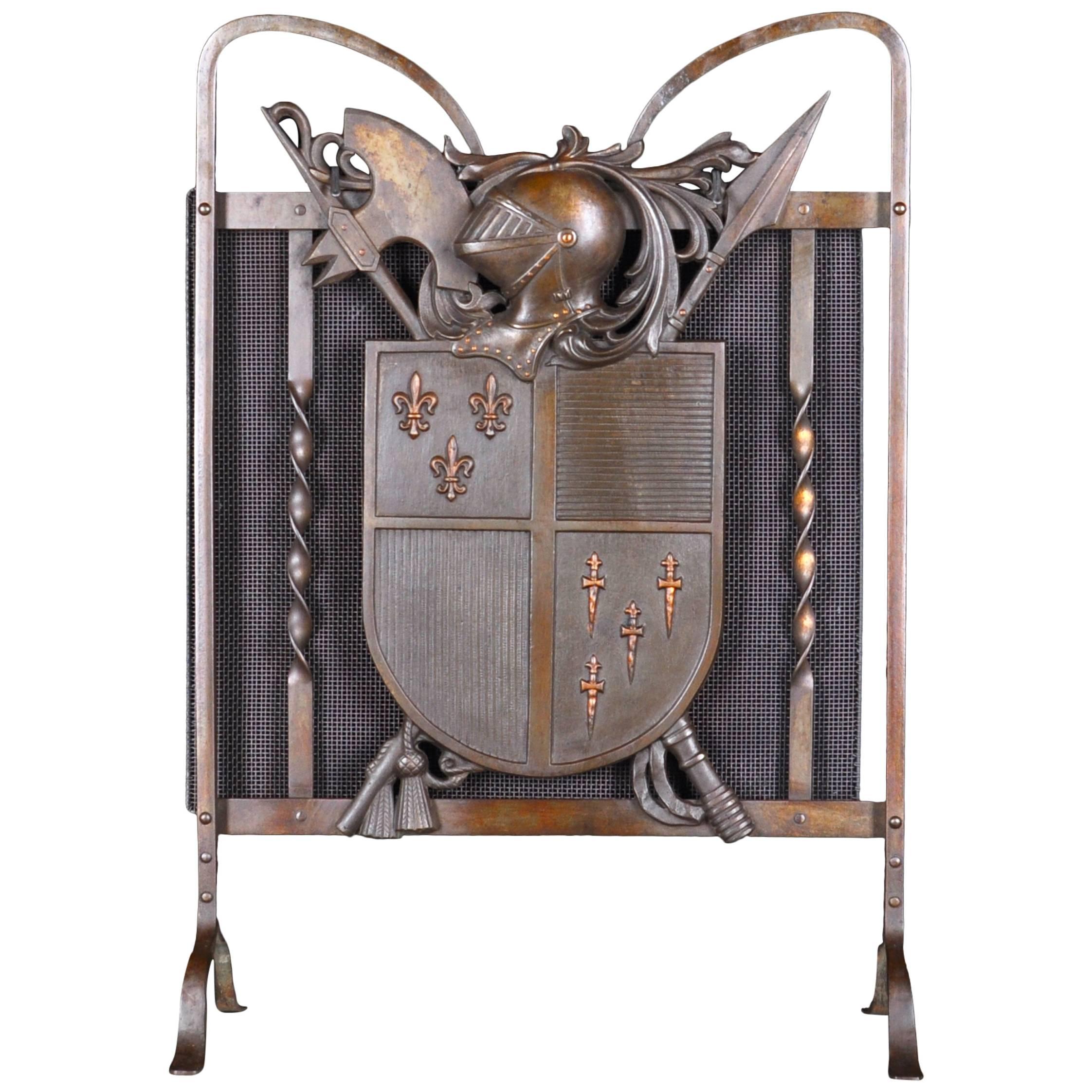 Armorial Bronze and Iron Fire-Guard with Medieval Trophies and Knight's Helmet