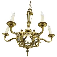 Lustre de style néoclassique français du début du XXe siècle en bronze avec clé grecque