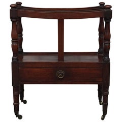Canterbury de caoba inglesa con pata torneada sobre rueda de volteo