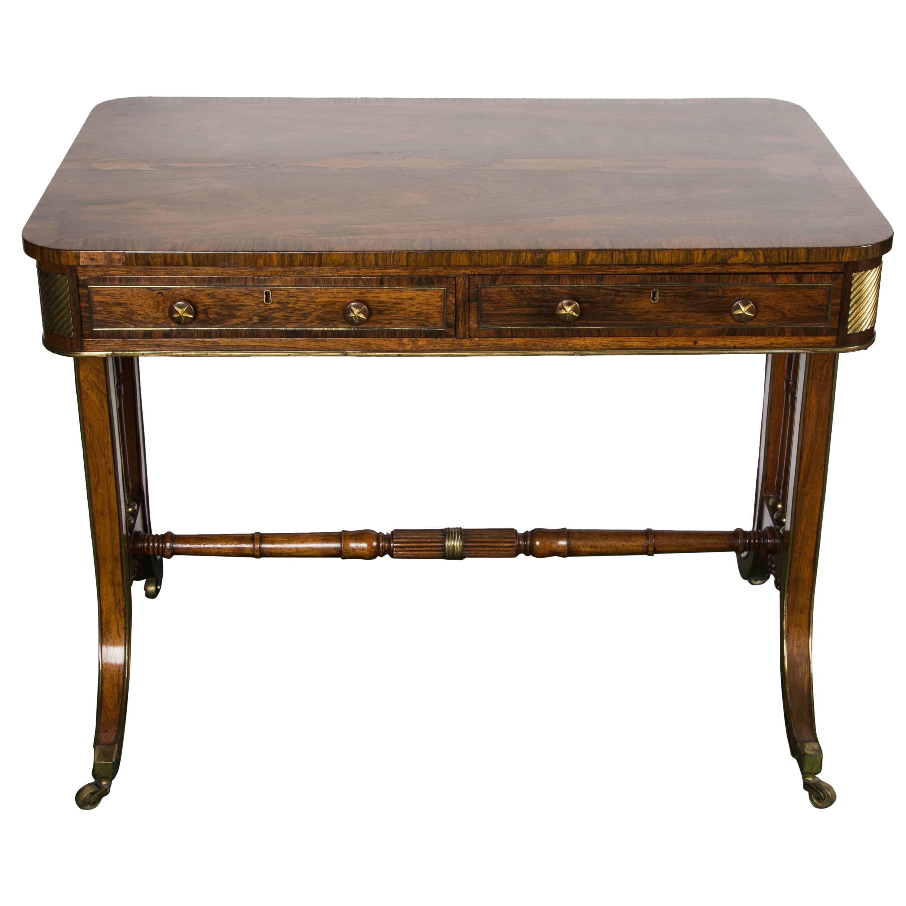 A very good quality Regency period rosewood crossbanded, end support, library table. Having two frieze drawers, dummy drawers to the reverse, ormolu mounts to each corner, ormolu mounted scrolls above the end supports, out swept legs terminating in