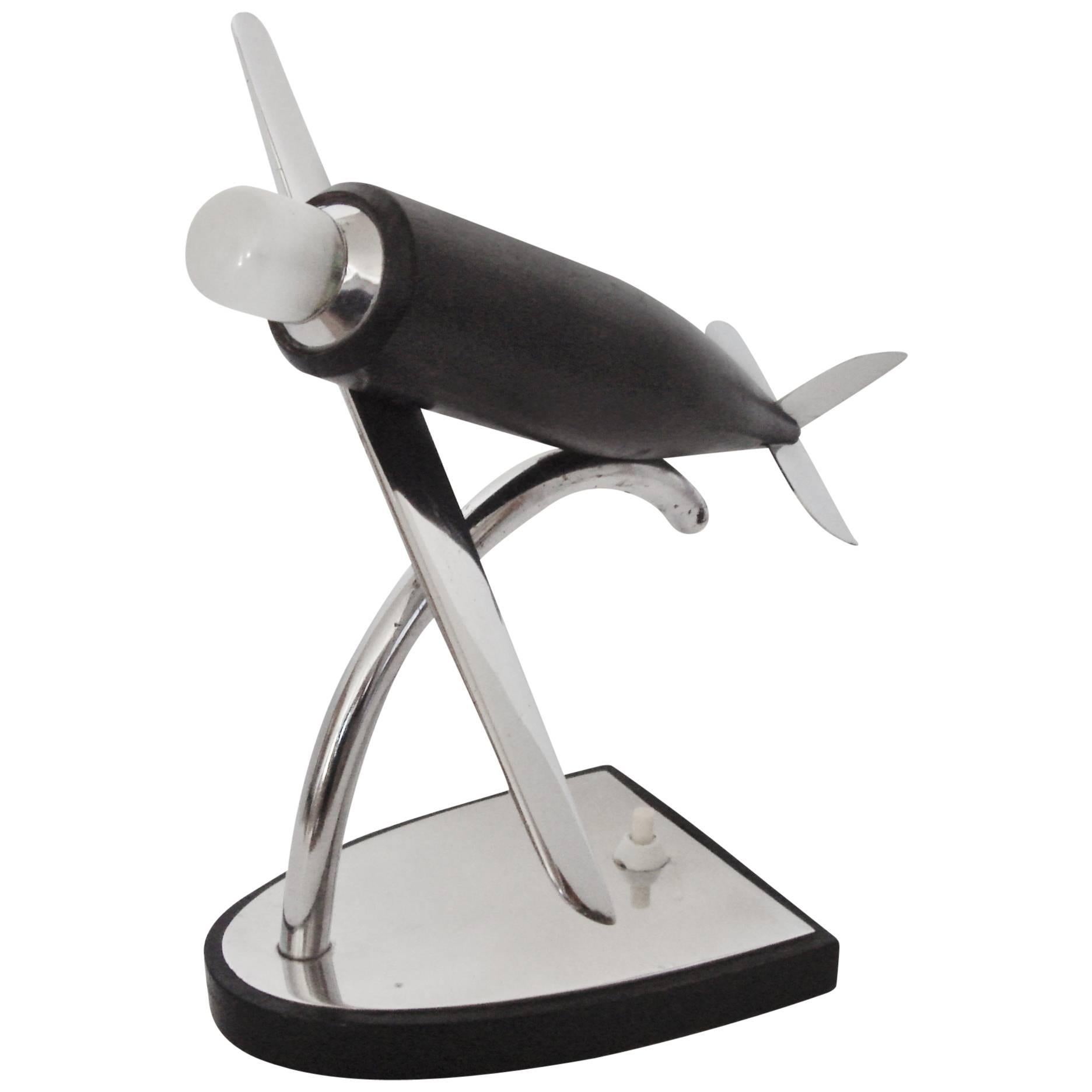 German Art Deco Chrome, Ebonized Wood and Bakelite Stylized Airplane Accent Lamp For Sale