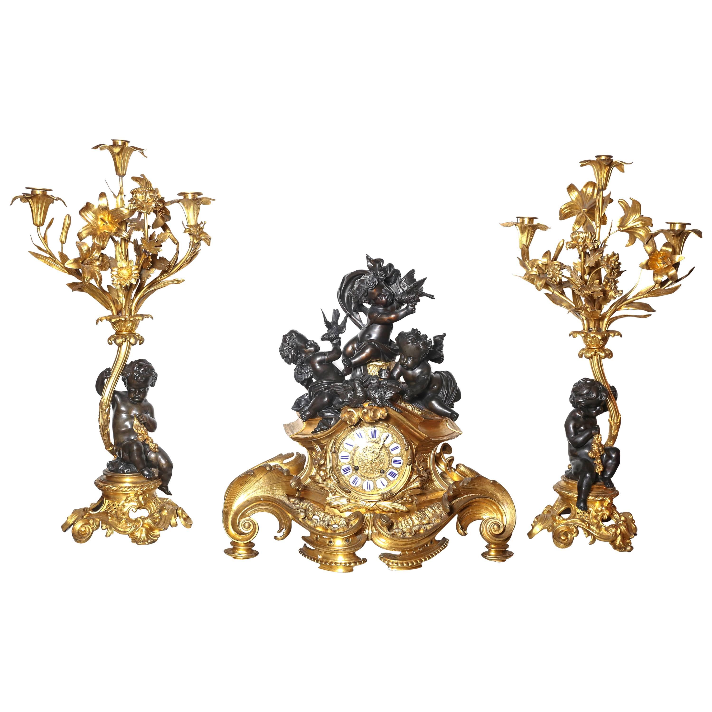 Three-Piece Gilt and Patinated Bronze Clock Garniture Set