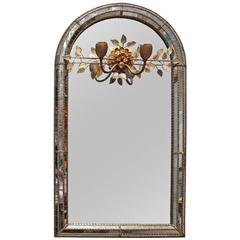 A French Bagues Mirror With An Incorporated Sconce