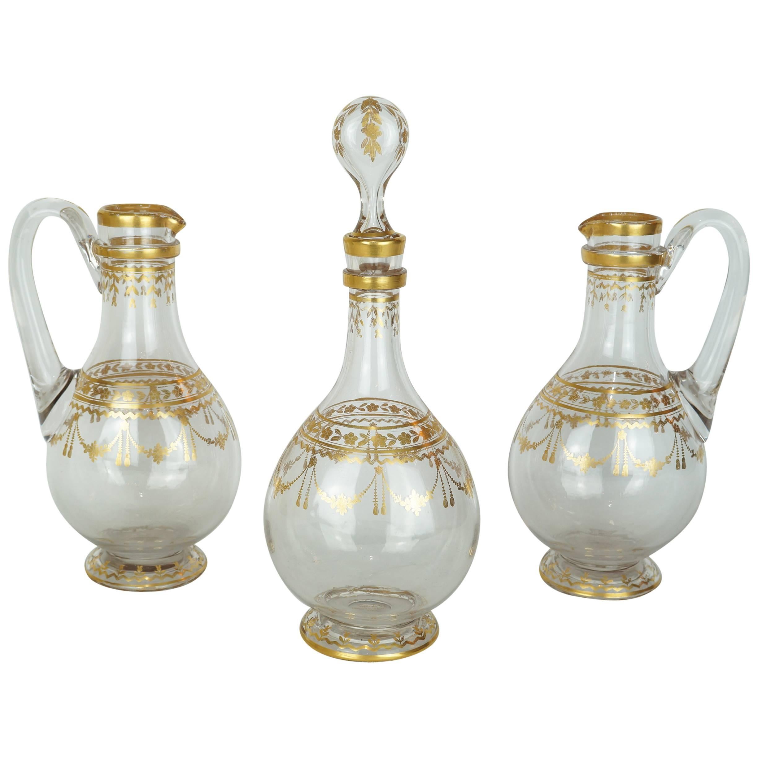 Three Piece Crystal Decanter Set with Gold Decorations Attributed to Baccarat