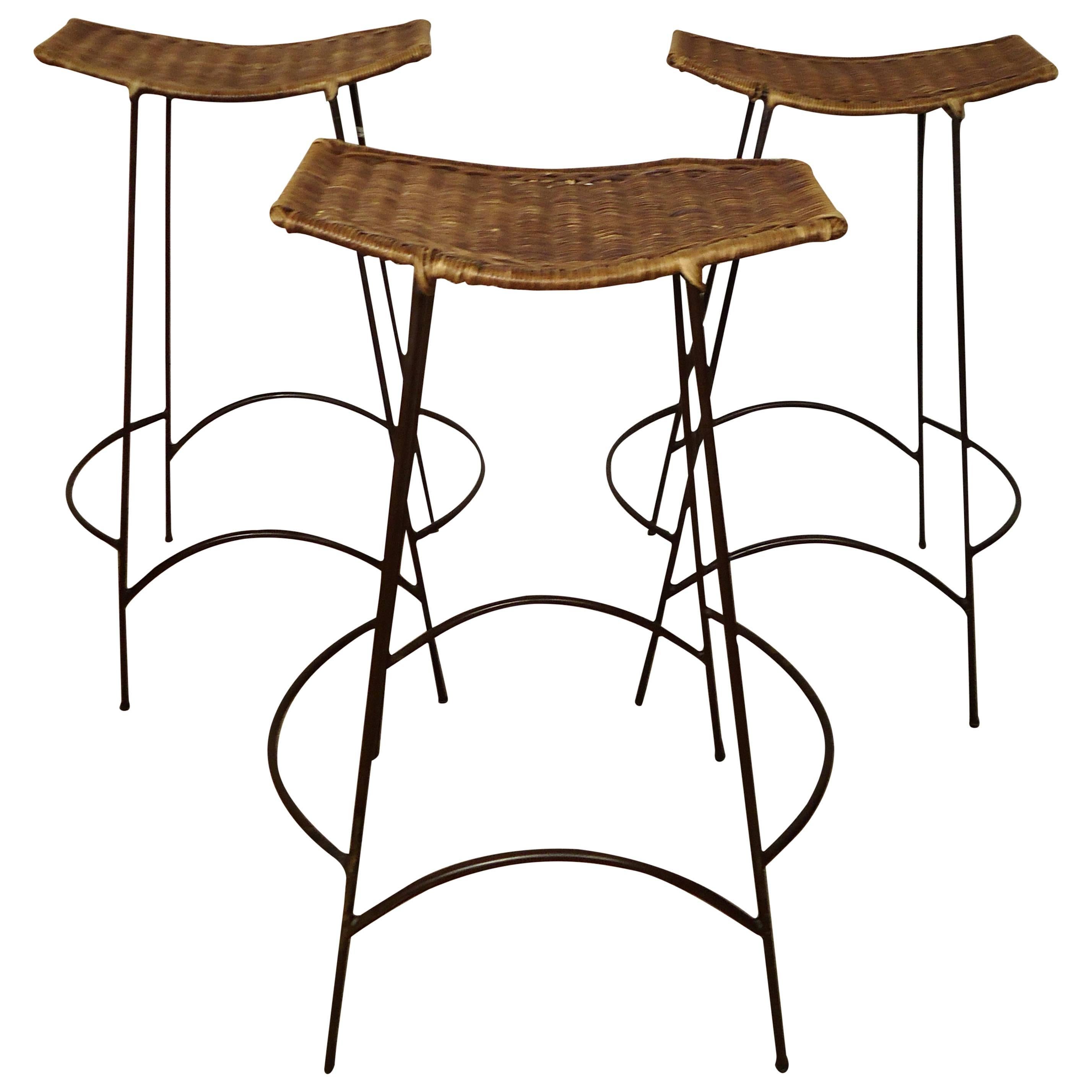 Three Mid-Century Iron and WIcker Stools