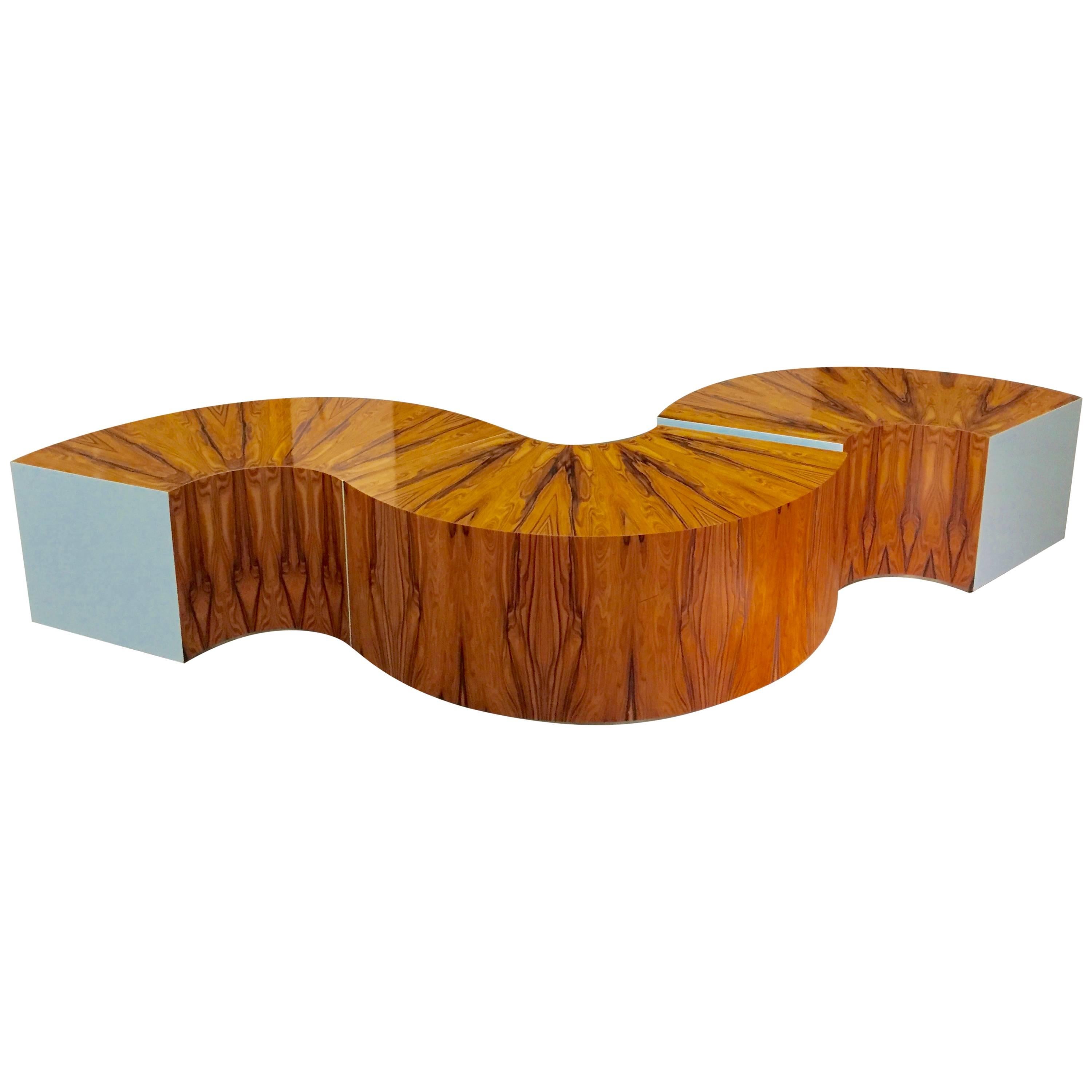 A beautifully designed and custom-made table by a noted California designer. The piece comes with a copy of the original invoice and the name of the designer and invoice will accompany the piece. It is made of three circular sections which can be