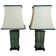 Pair of Patinated Bronze and Ebonized Wood Lamps