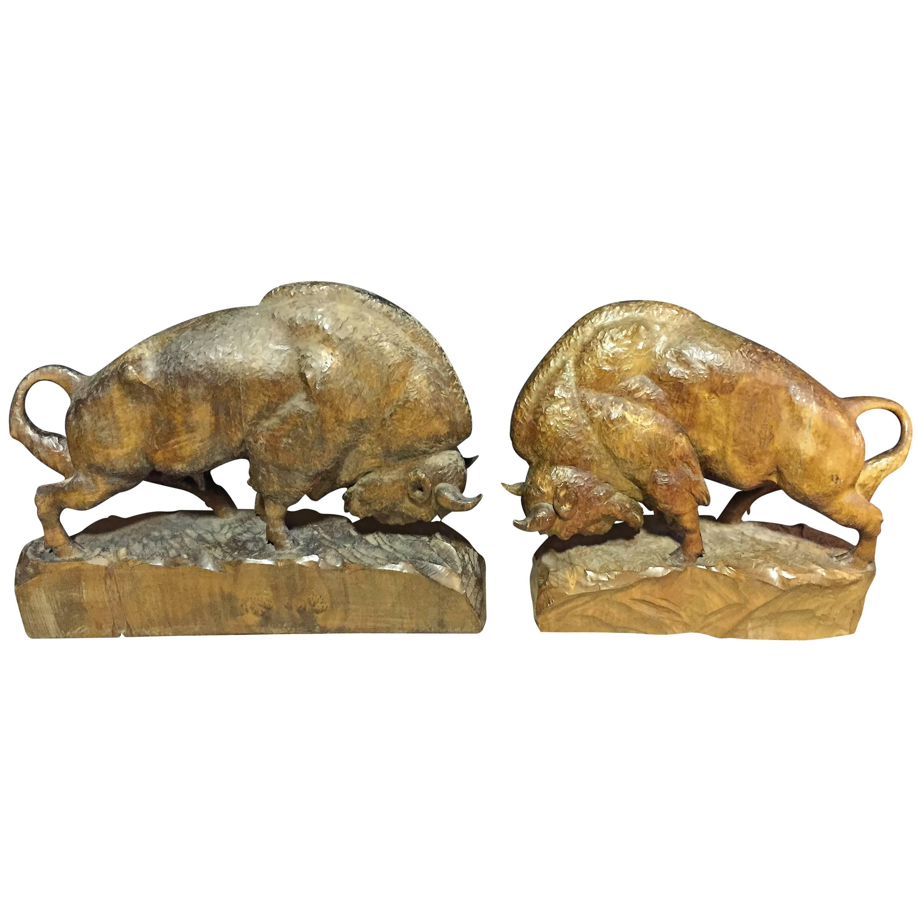 Set of hand-carved wooden bisons with nice patina