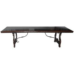 An Elegant Italian Walnut Wood Table with Iron Stretchers