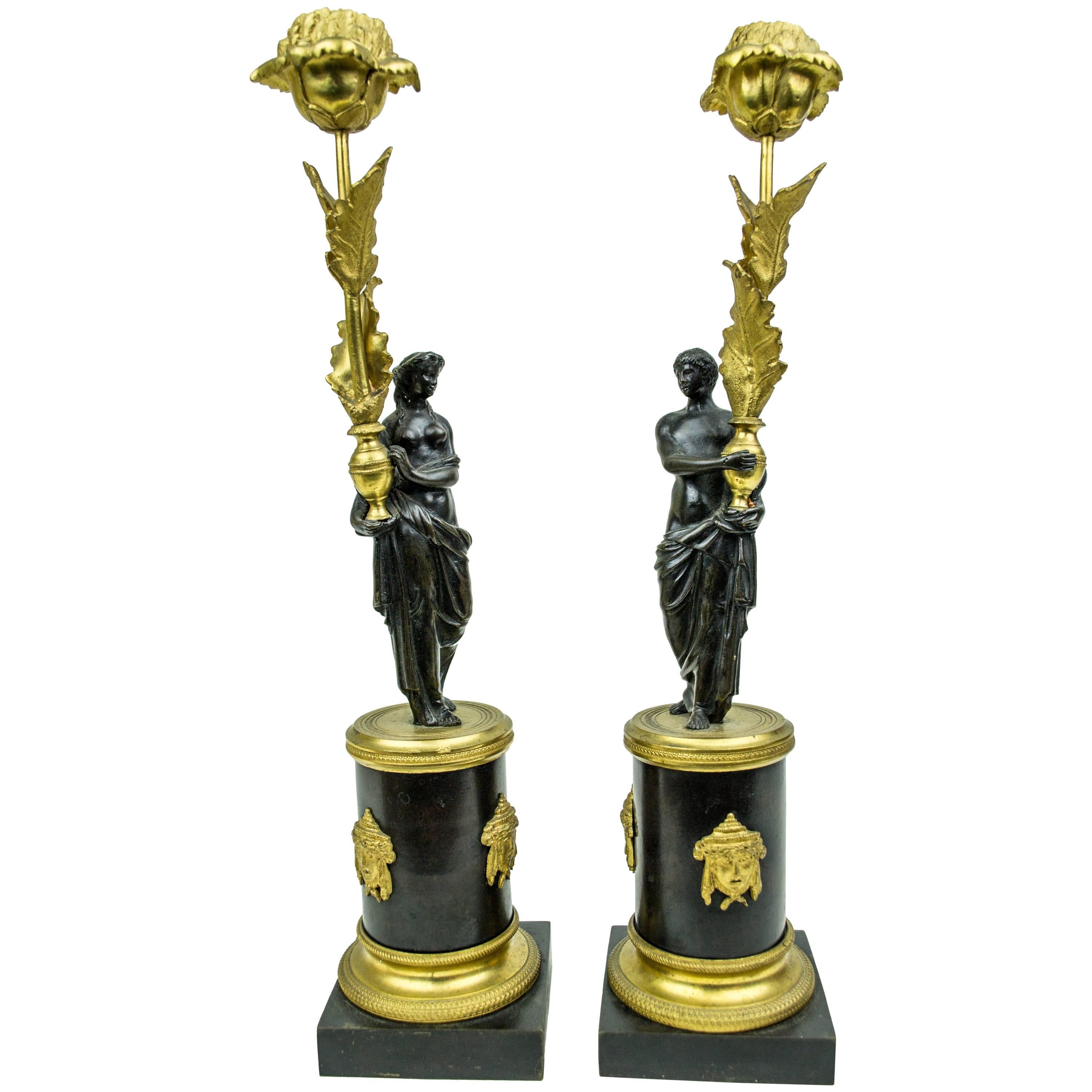 Pair of French Gilt and Patinated Bronze Figural Candlesticks
