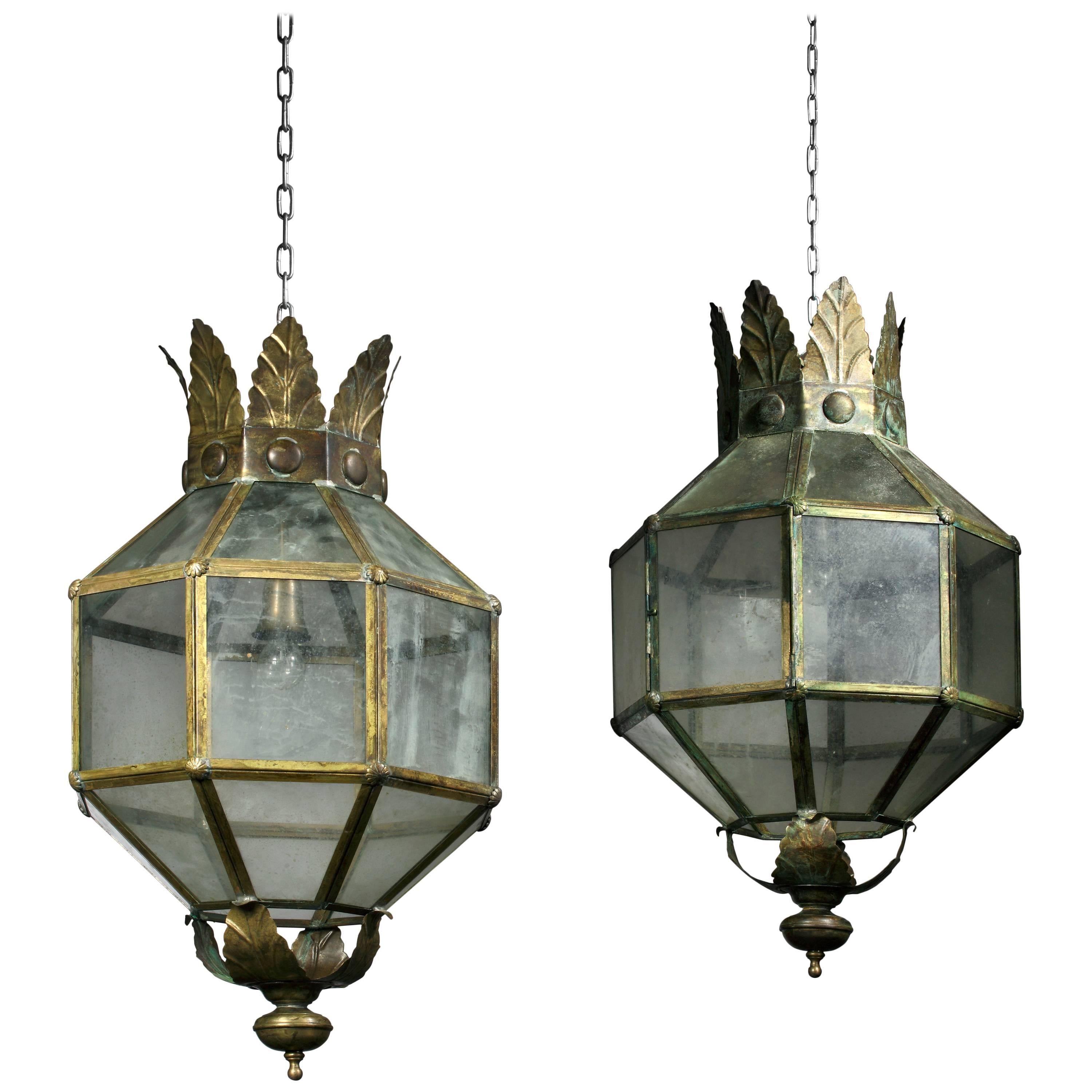 A pair of large aged copper and glazed octagonal section lanterns