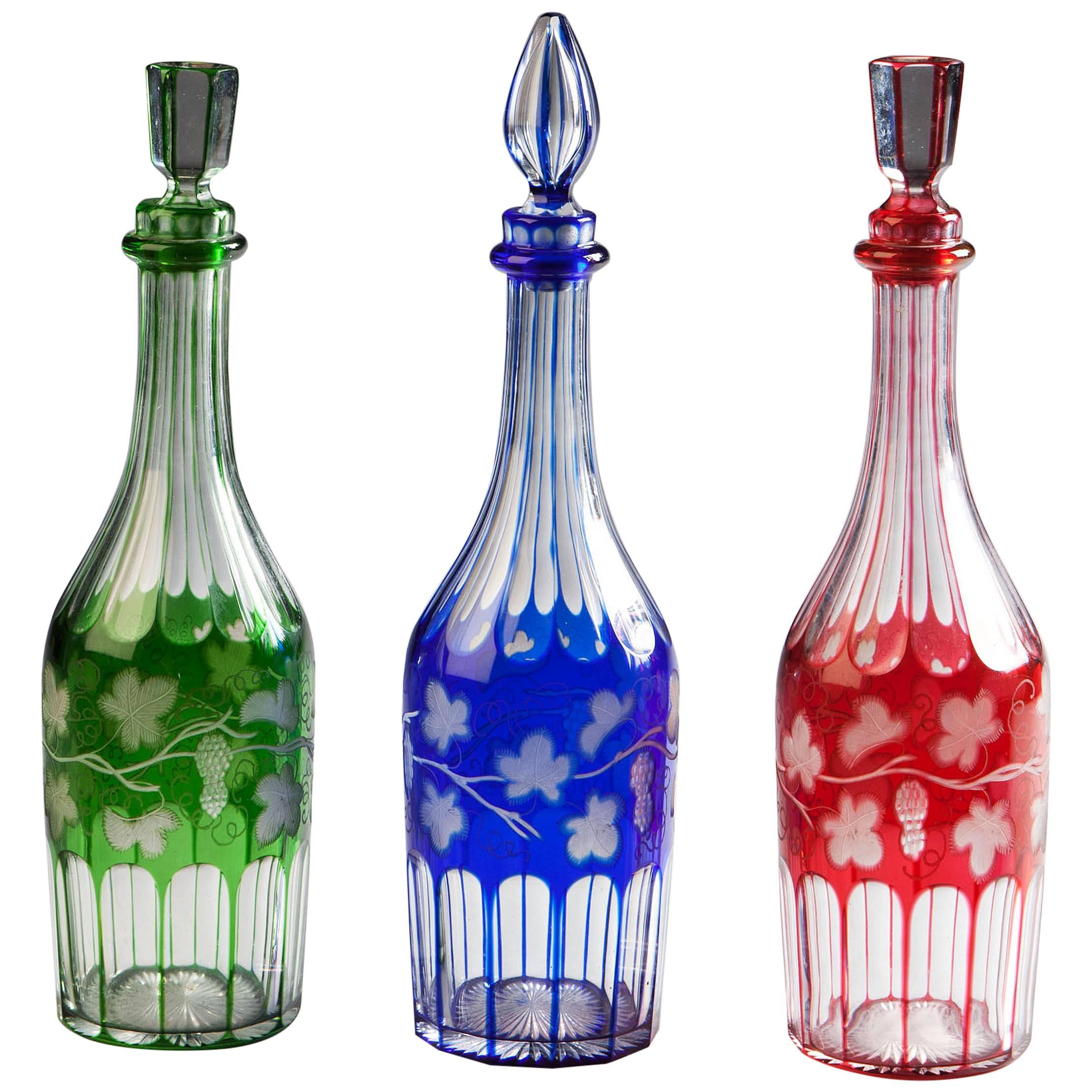 Set of Three Coloured Glass Bottles