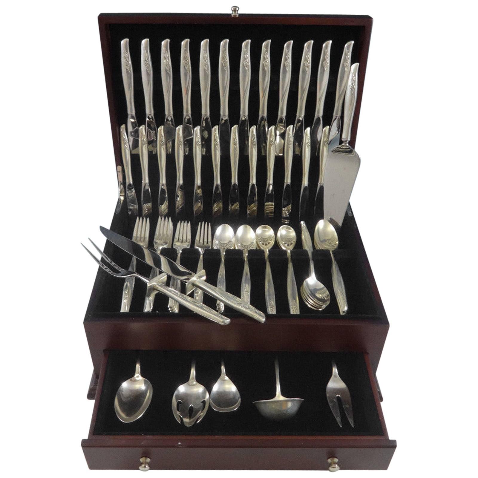 Large sea rose by Gorham sterling silver flatware set of 92 pieces. This pattern has a flowing modern design and was designed by Richard L. Huggins in the year 1958. This set includes:

12 knives, 9 1/4