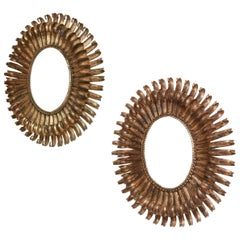Pair of Gilded Iron Oval "Eyelash" Mirrors