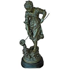 Spelter Figurine of Girl on a River Bank Sculpture