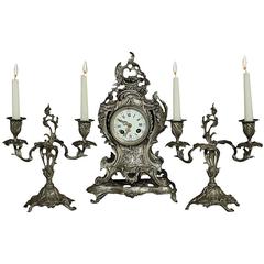 19th Century French Rococo Bronze Mantel Clock and Pair of Candlesticks