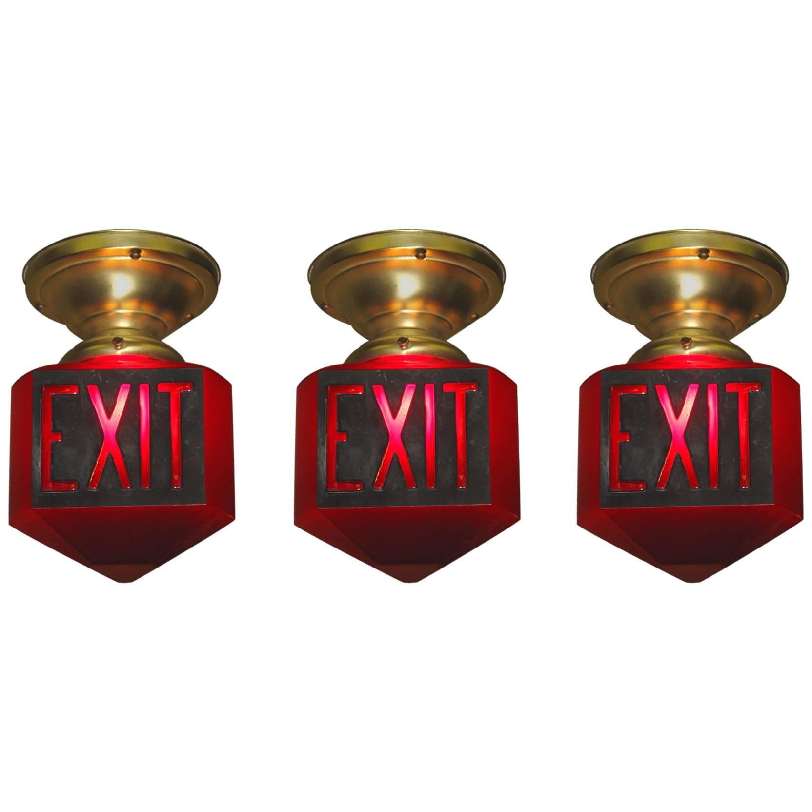Three Matching 1920s Ruby Red Triangle Exit Signs Priced Each