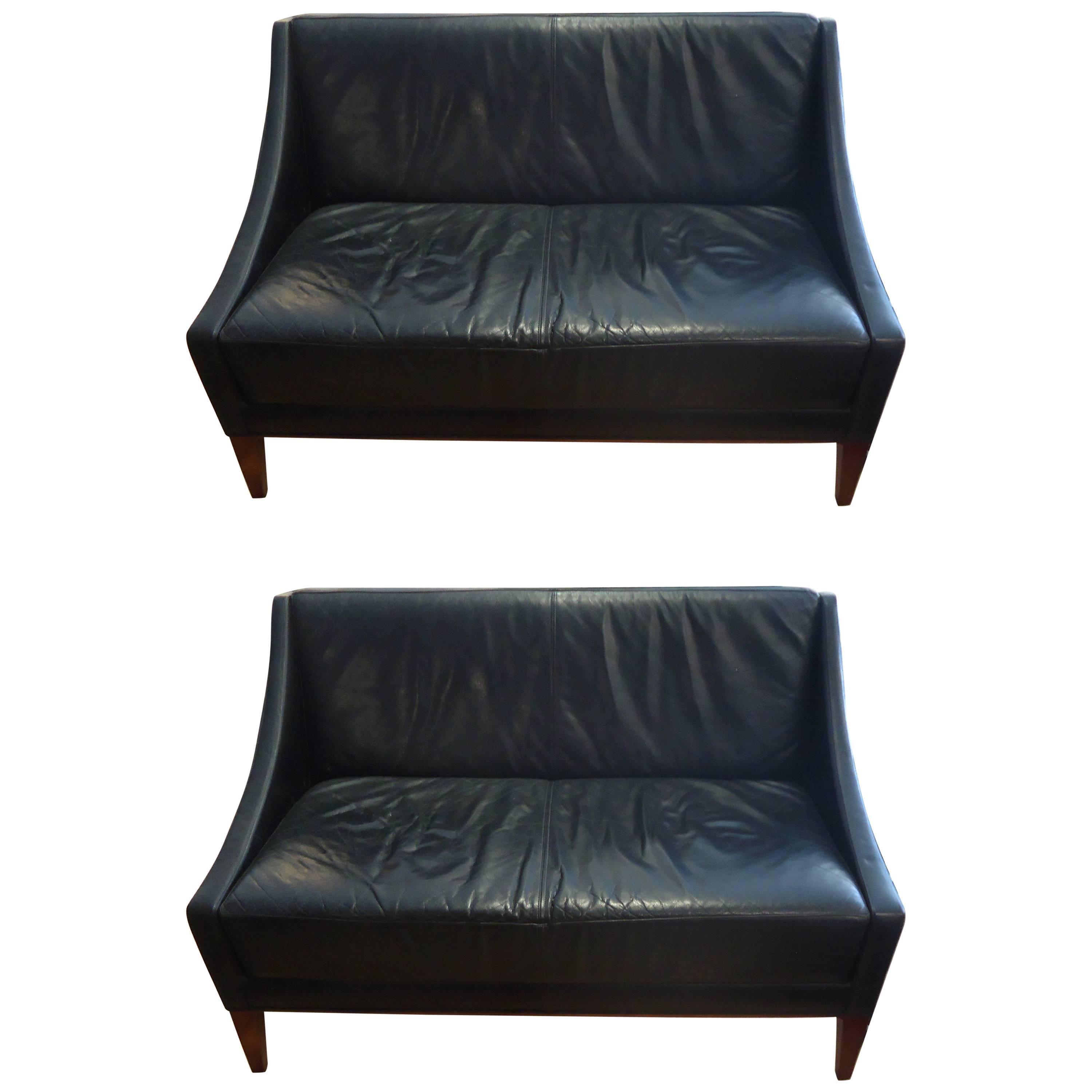 Pair of Sleek Mid-Century Modern Black Leather Loveseats