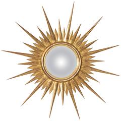 Spiegel mit Sonnenschliff in antikem Blattgold