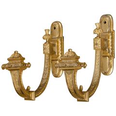 A pair of French gilt brass curtain tie-backs. 5